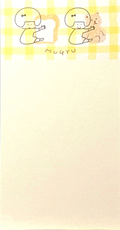 ゆるいタッチで描かれた女の子とくまのイラストが入った、ふんわり優しい雰囲気のスリムメモ帳。淡い色のデコレーションが特徴。/  
A slim memo pad featuring soft pastel decorations and gentle hand-drawn illustrations of a girl and bears — soothing and whimsical stationery design.